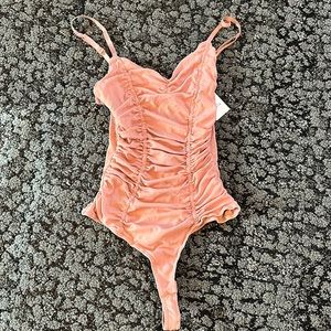 Never been worn pink bodysuit